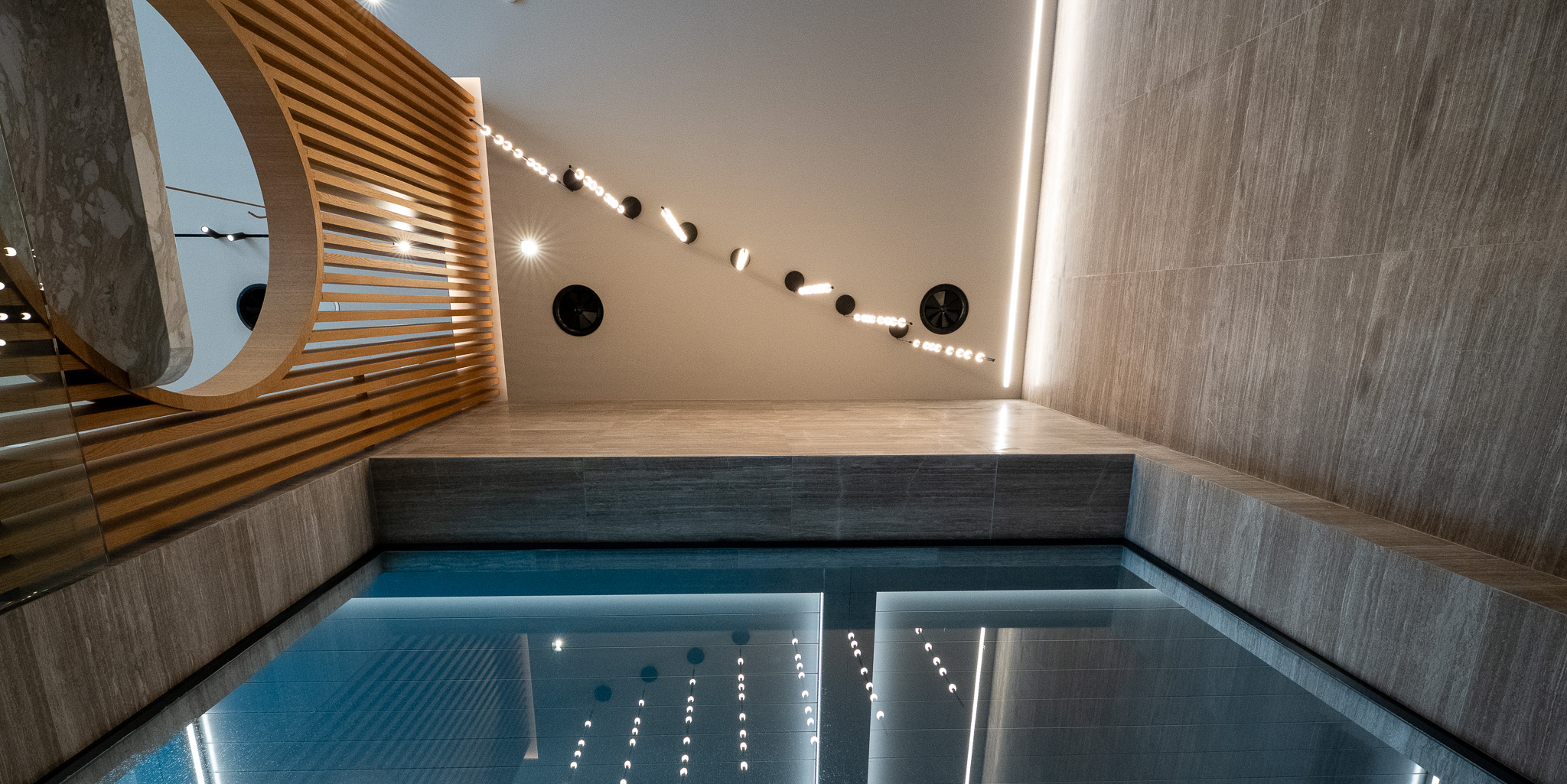 Dusit Suites Athens, indoor pool edge with diagonal LED feature