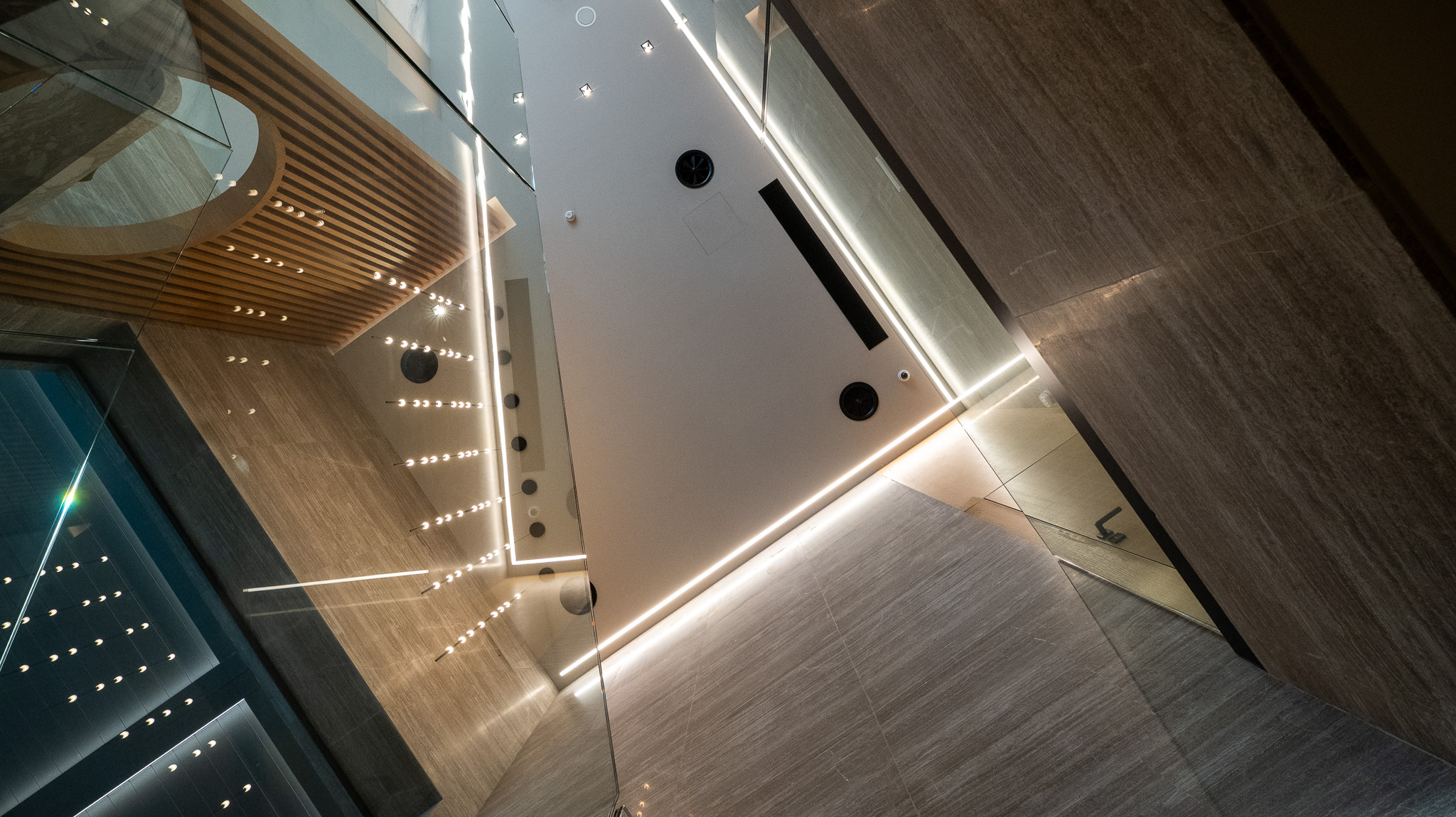 Dusit Suites Athens, architectural ceiling abstract of staircase underside with LED runs