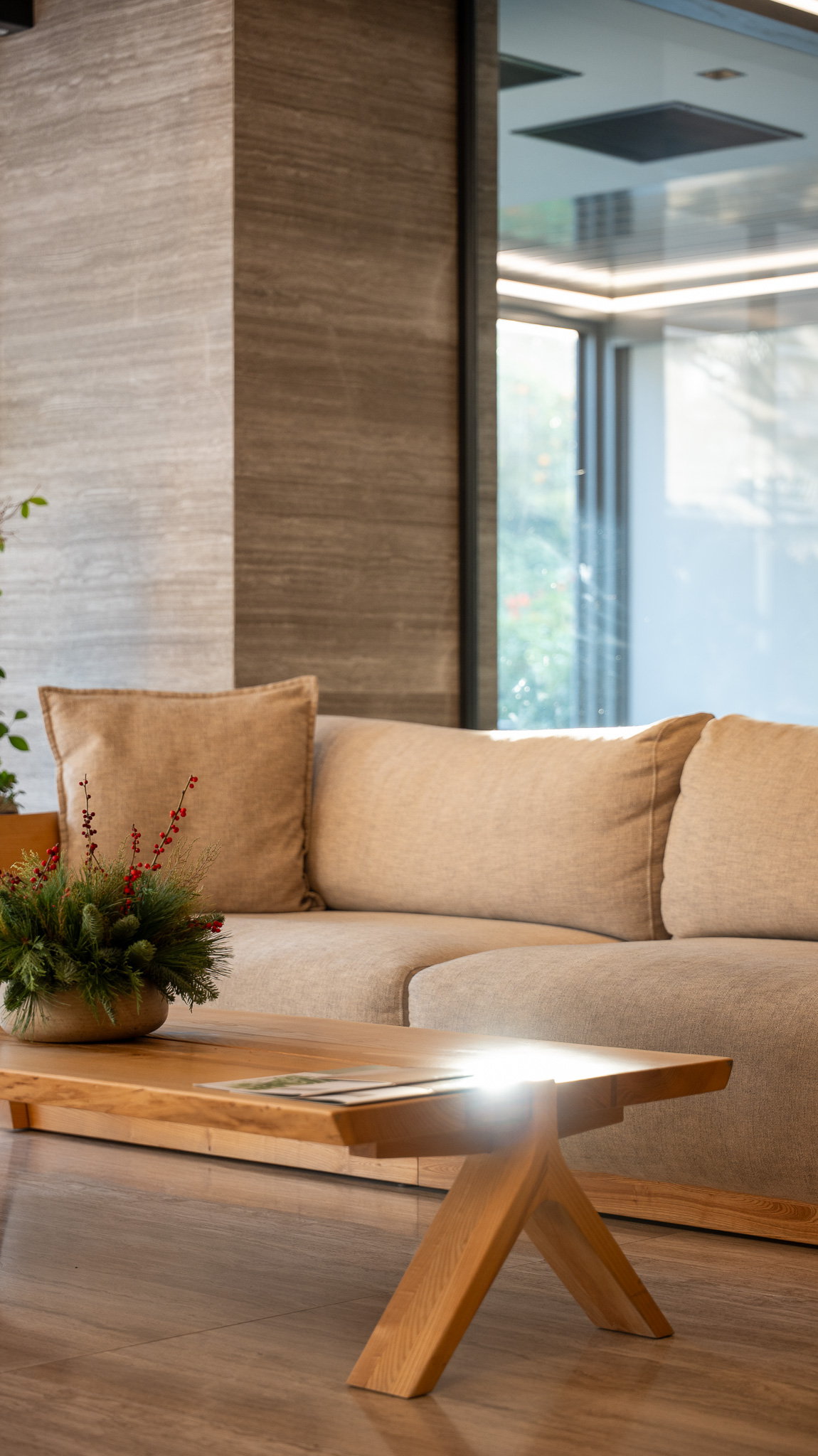 Dusit Suites Athens, suite living corner with linen sofa and live-edge oak coffee table