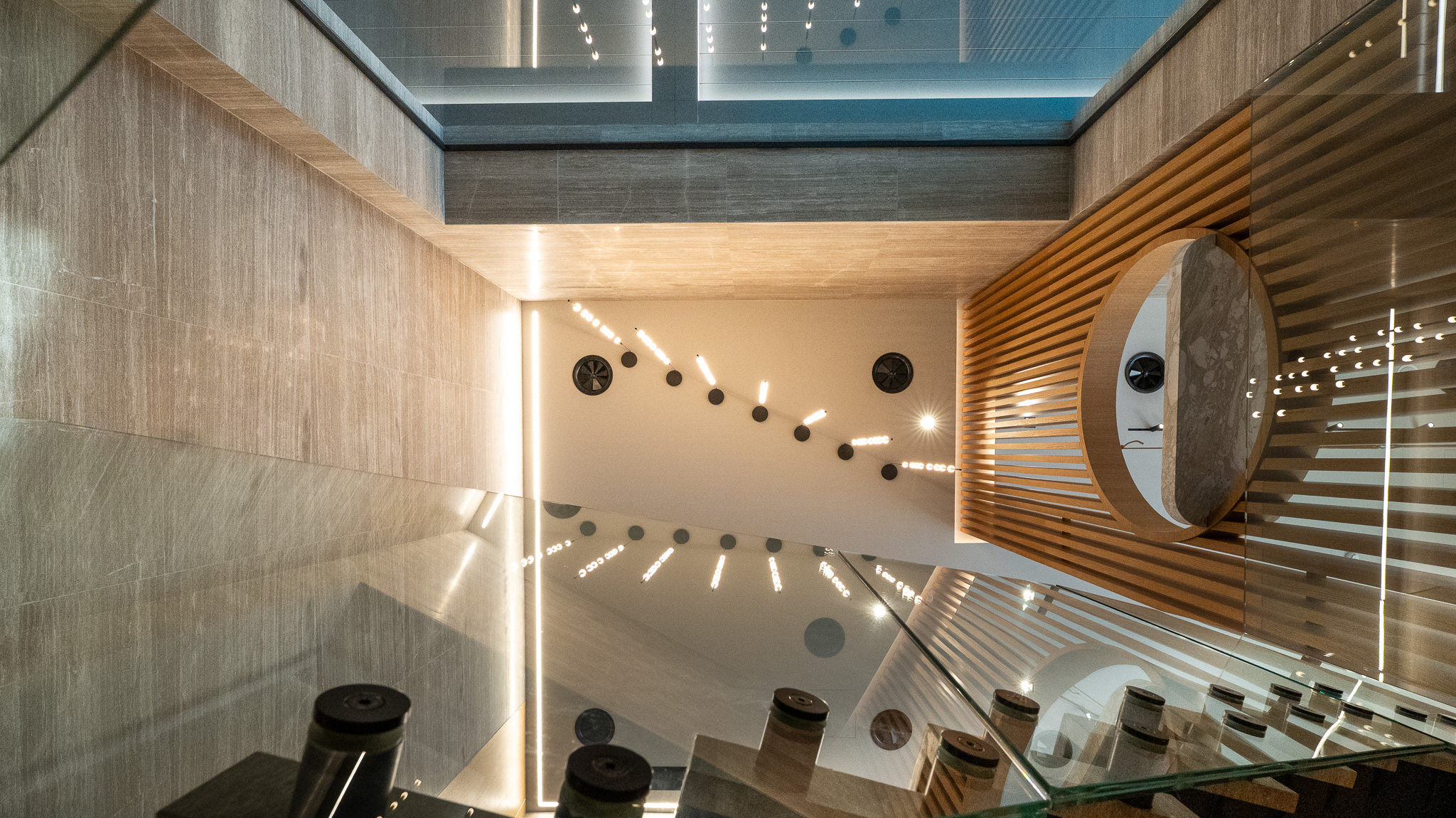 Dusit Suites Athens, architectural detail of staircase soffit and circular wood window