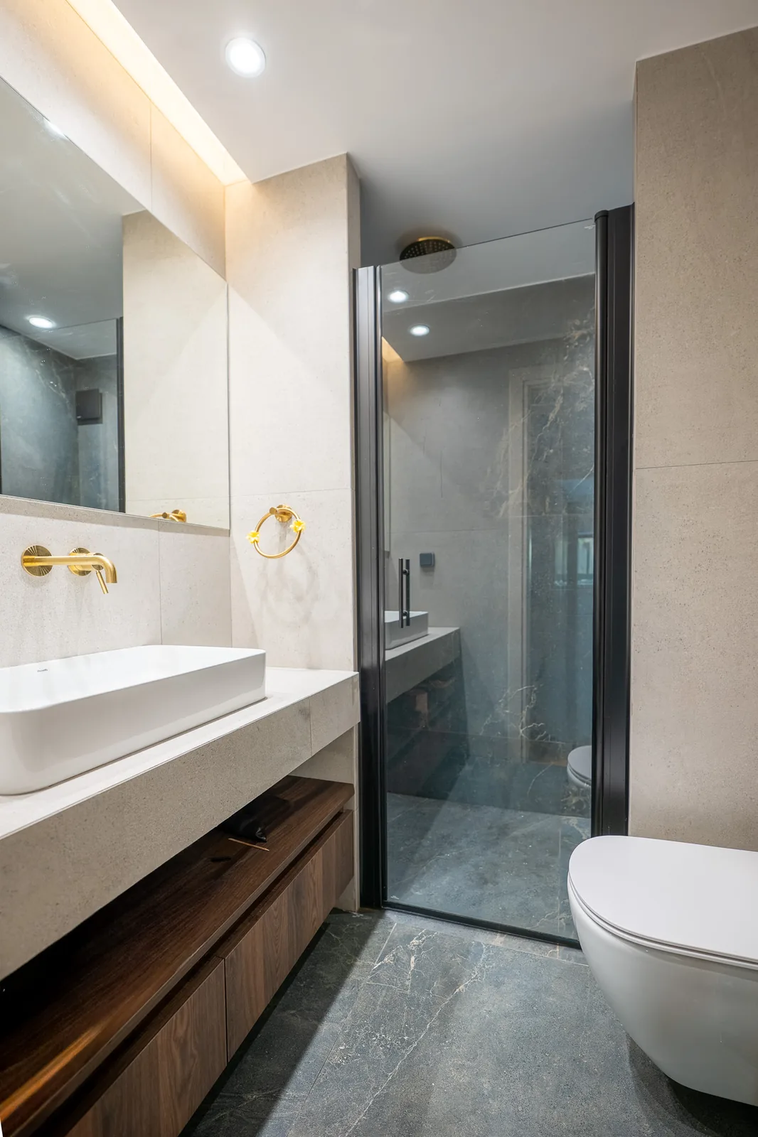 Kitsos Constructions residence, bathroom with walk-in shower and stone basin