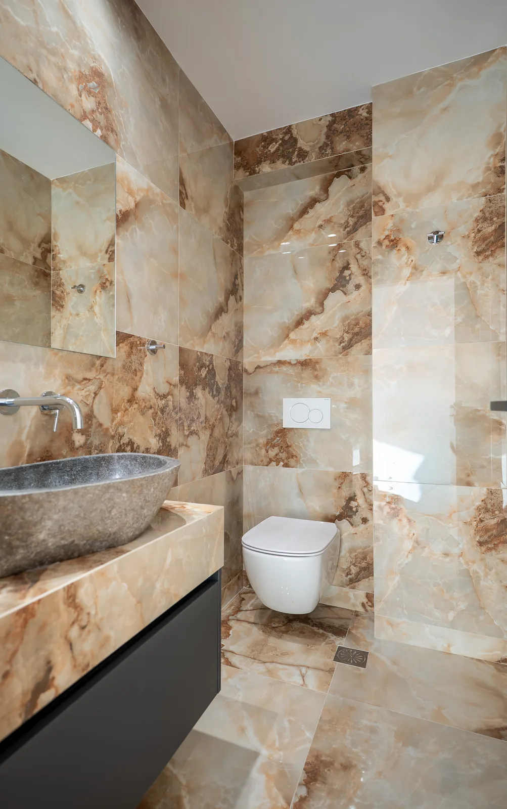 Kitsos Constructions residence, onyx marble bathroom with stone basin
