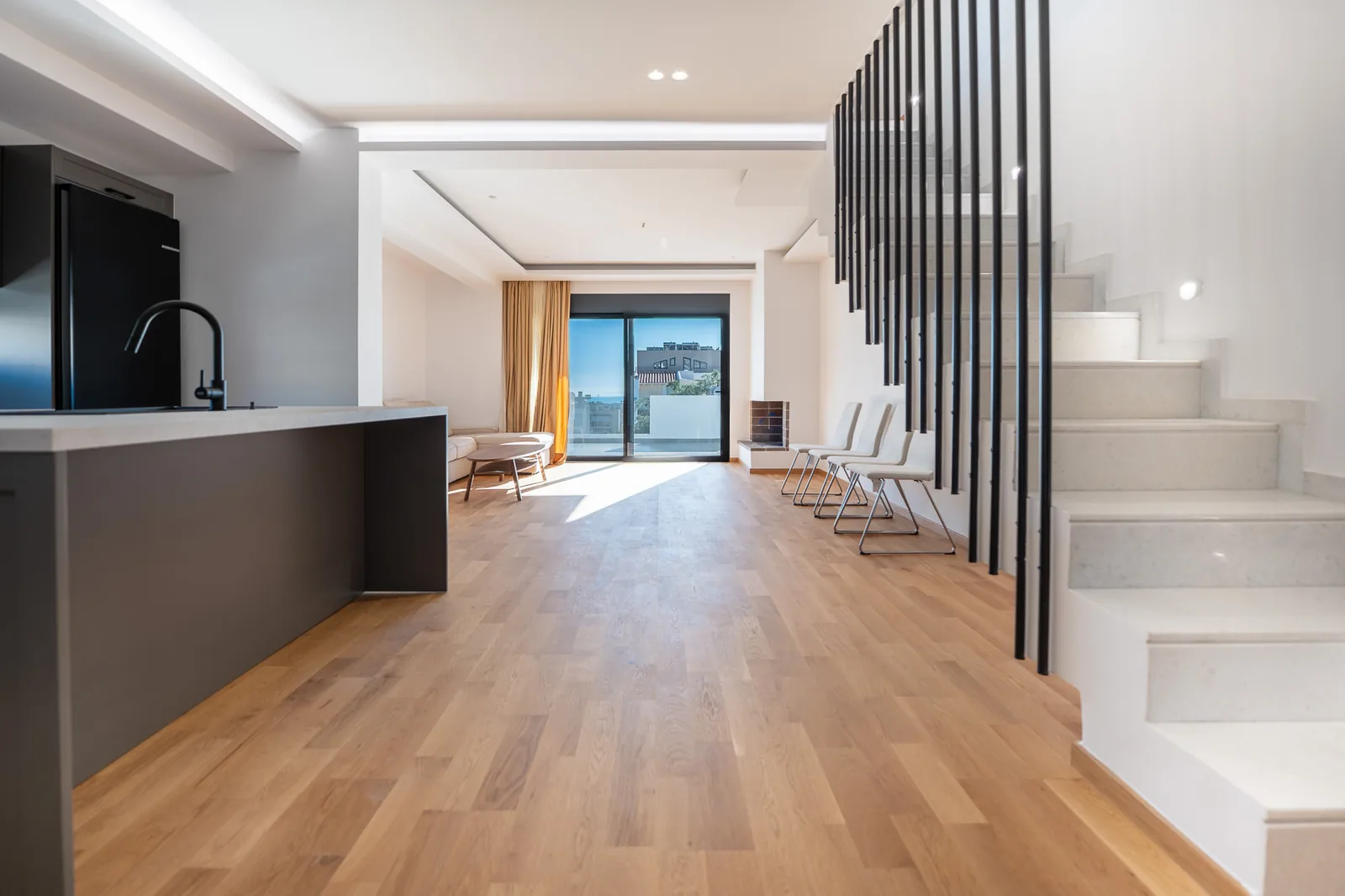 Kitsos Constructions residence, open-plan living in oak and white with the marble stair
