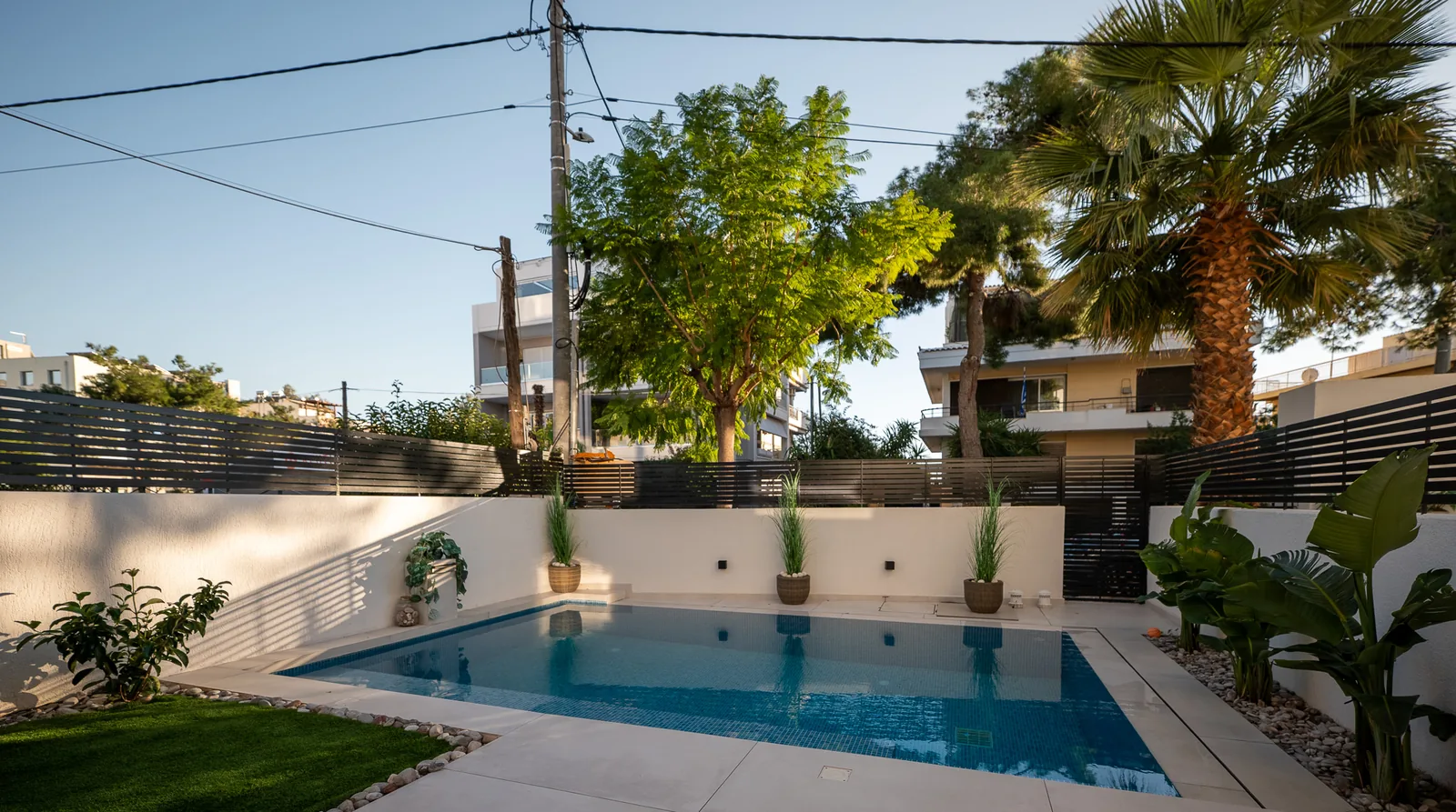 Kitsos Constructions residence, the exterior with the pool and garden