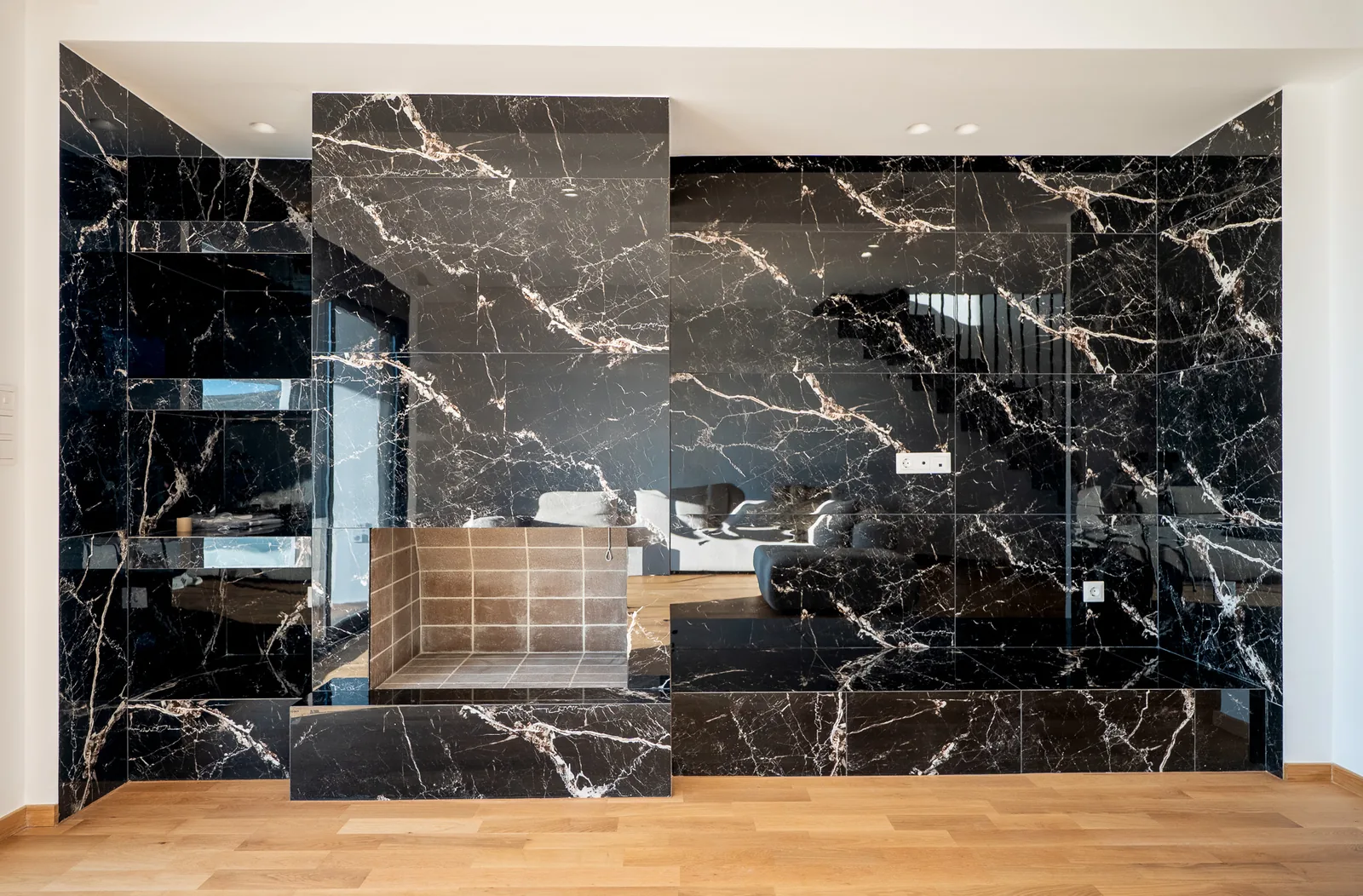 Kitsos Constructions residence, the lounge against the dark marble wall