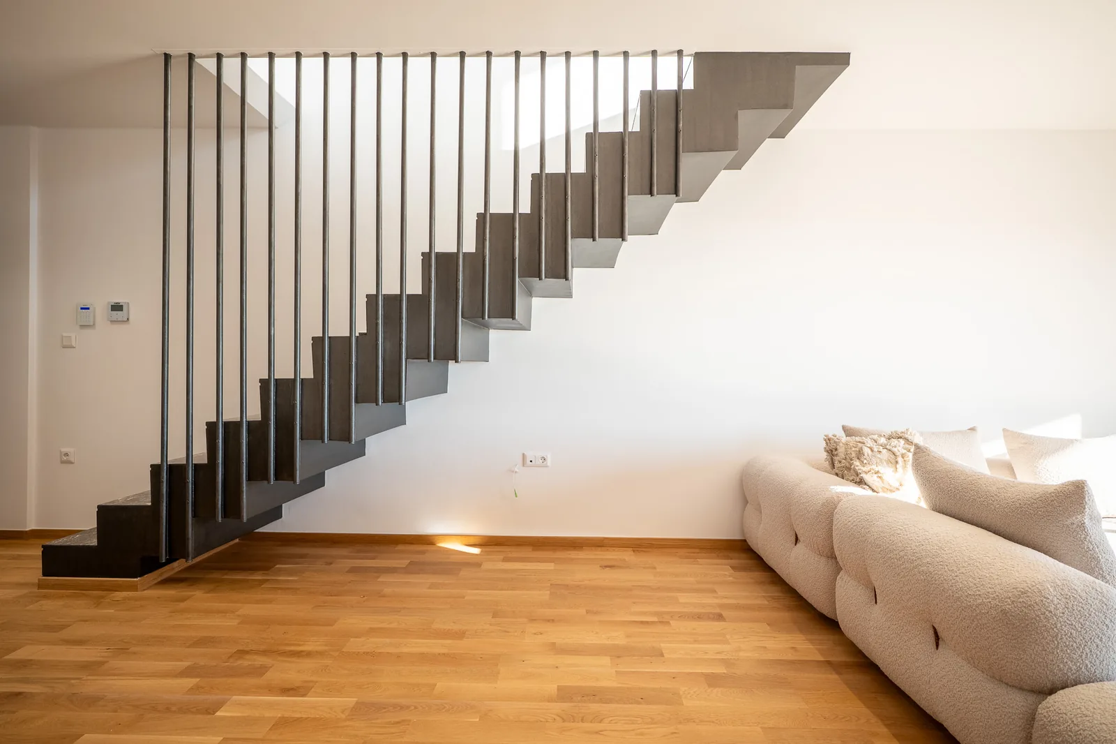 Kitsos Constructions residence, the floating staircase beside the living area