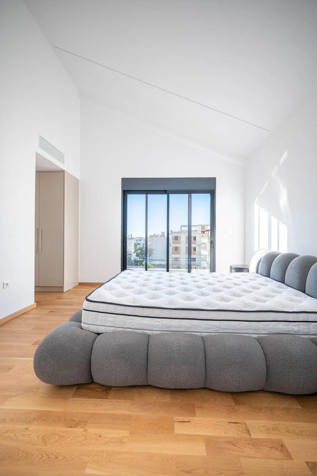 Kitsos Constructions residence, a bedroom in oak and white