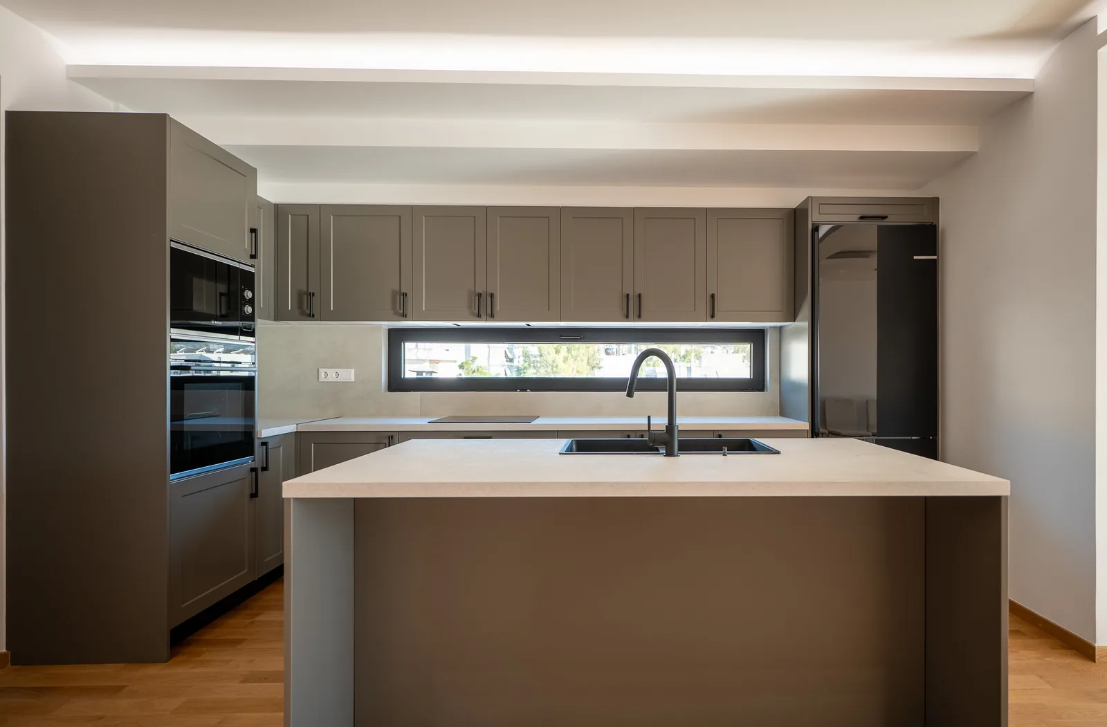 Kitsos Constructions residence, kitchen with island and integrated appliances