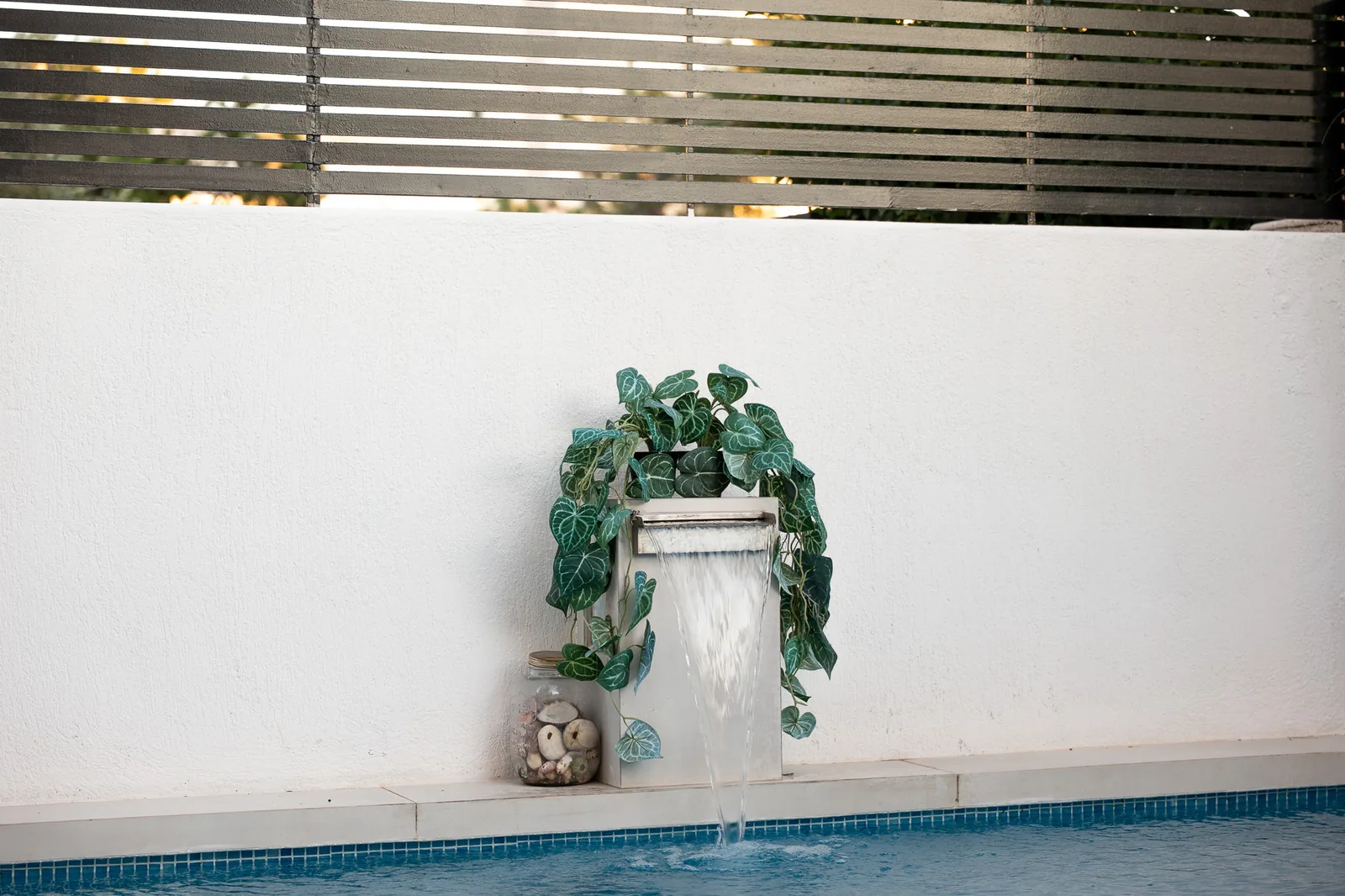 Kitsos Constructions residence, pool courtyard with a planted water feature