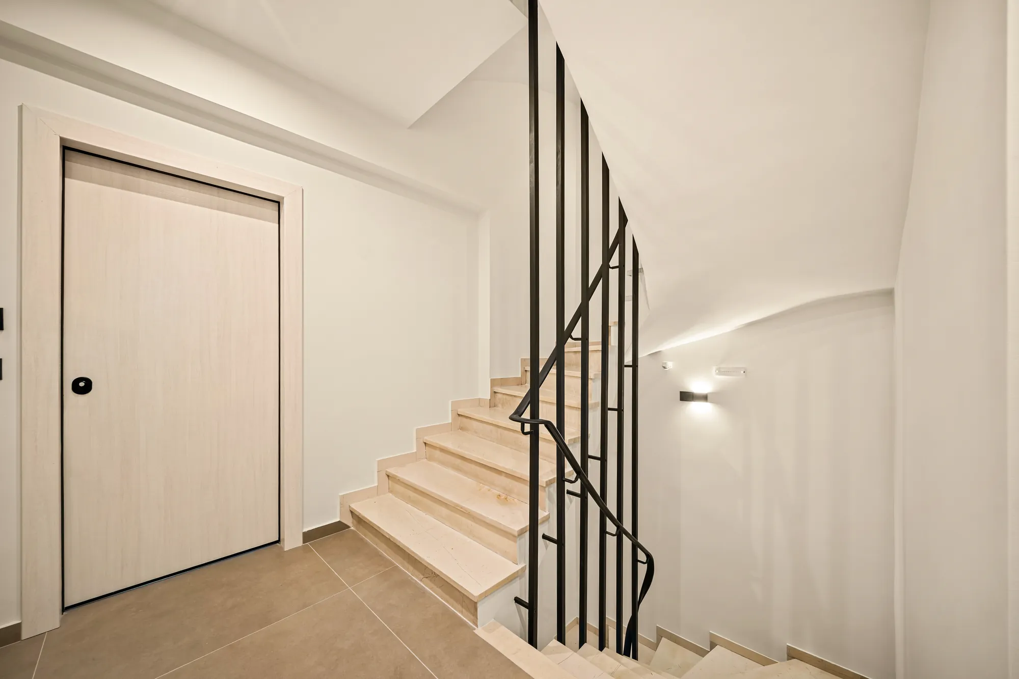ORMOS Piraeus, the stair with its slim black balustrade
