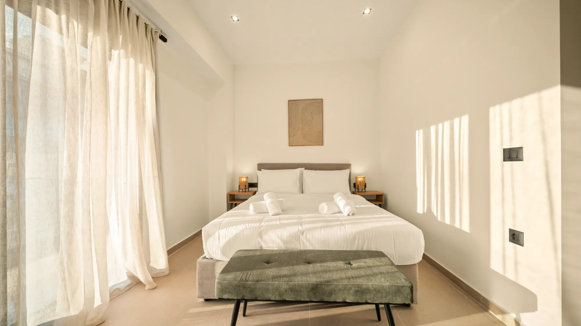 ORMOS Piraeus, the bed and bench under the woven artwork