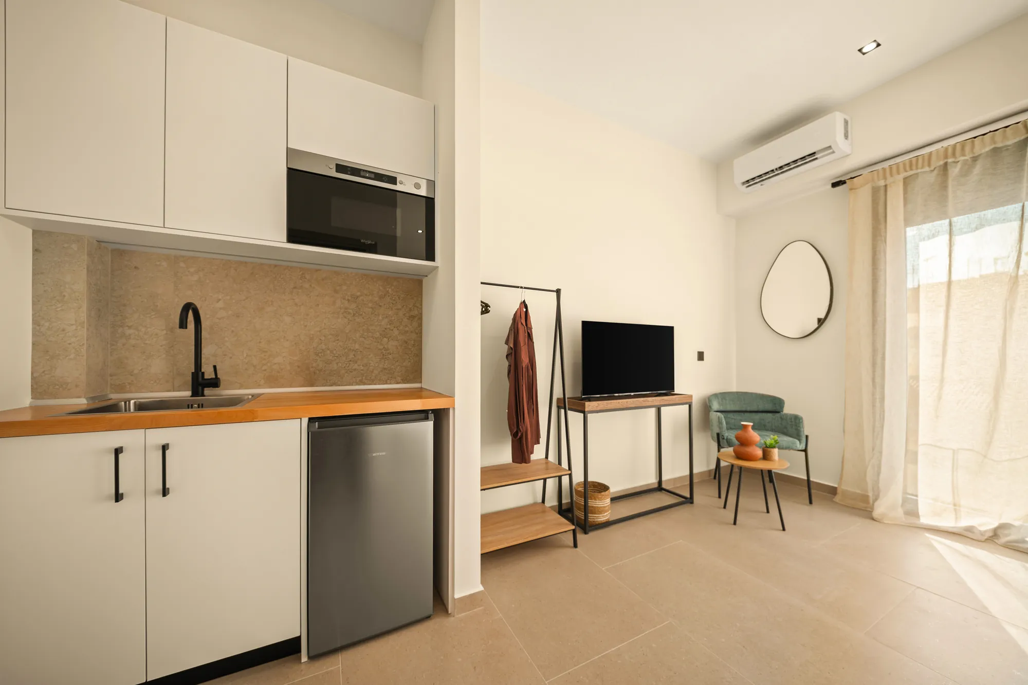 ORMOS Piraeus, the kitchenette with its oak worktop and black tap