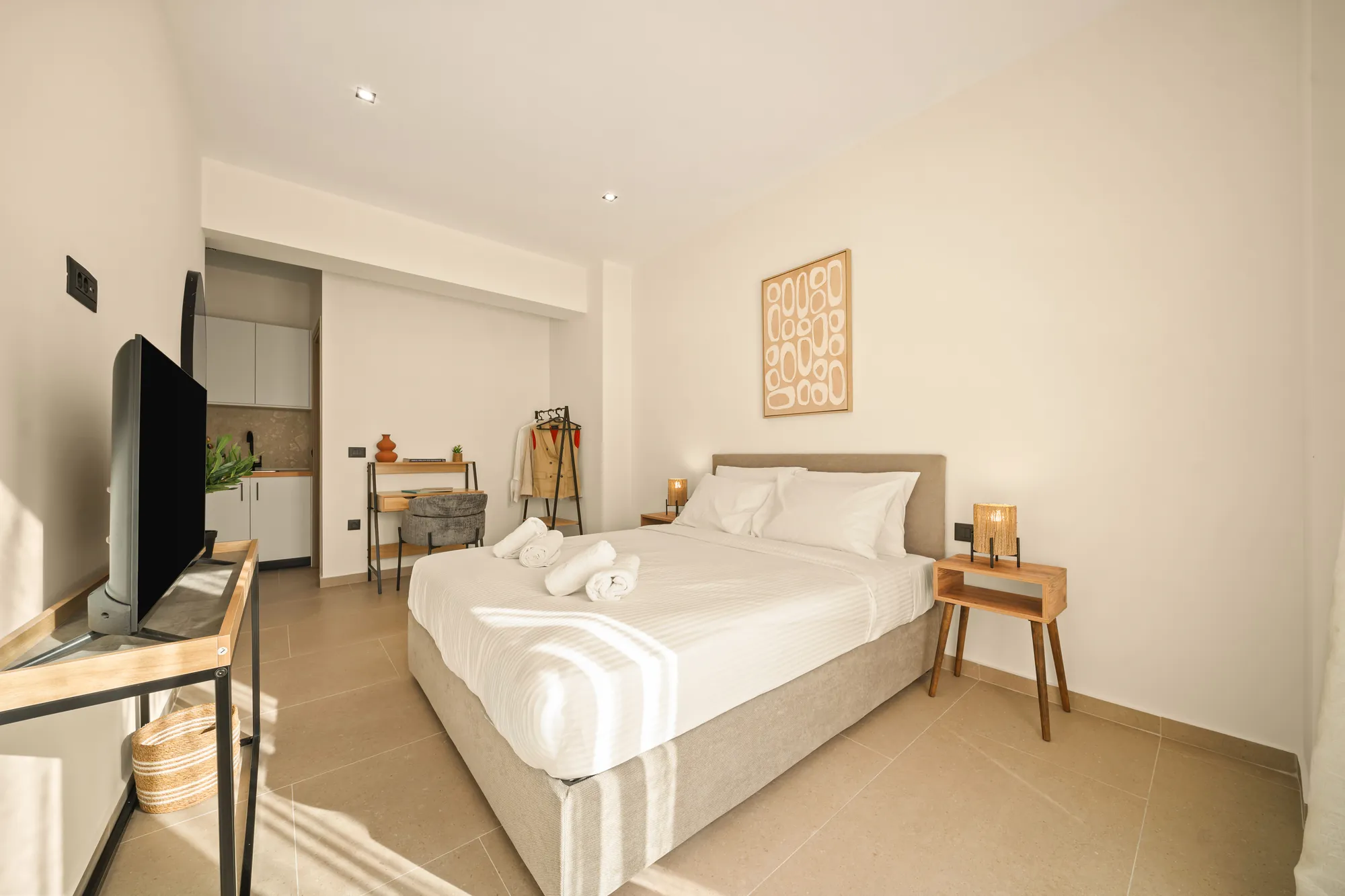 ORMOS Piraeus, the bed and the television, the artwork on the wall