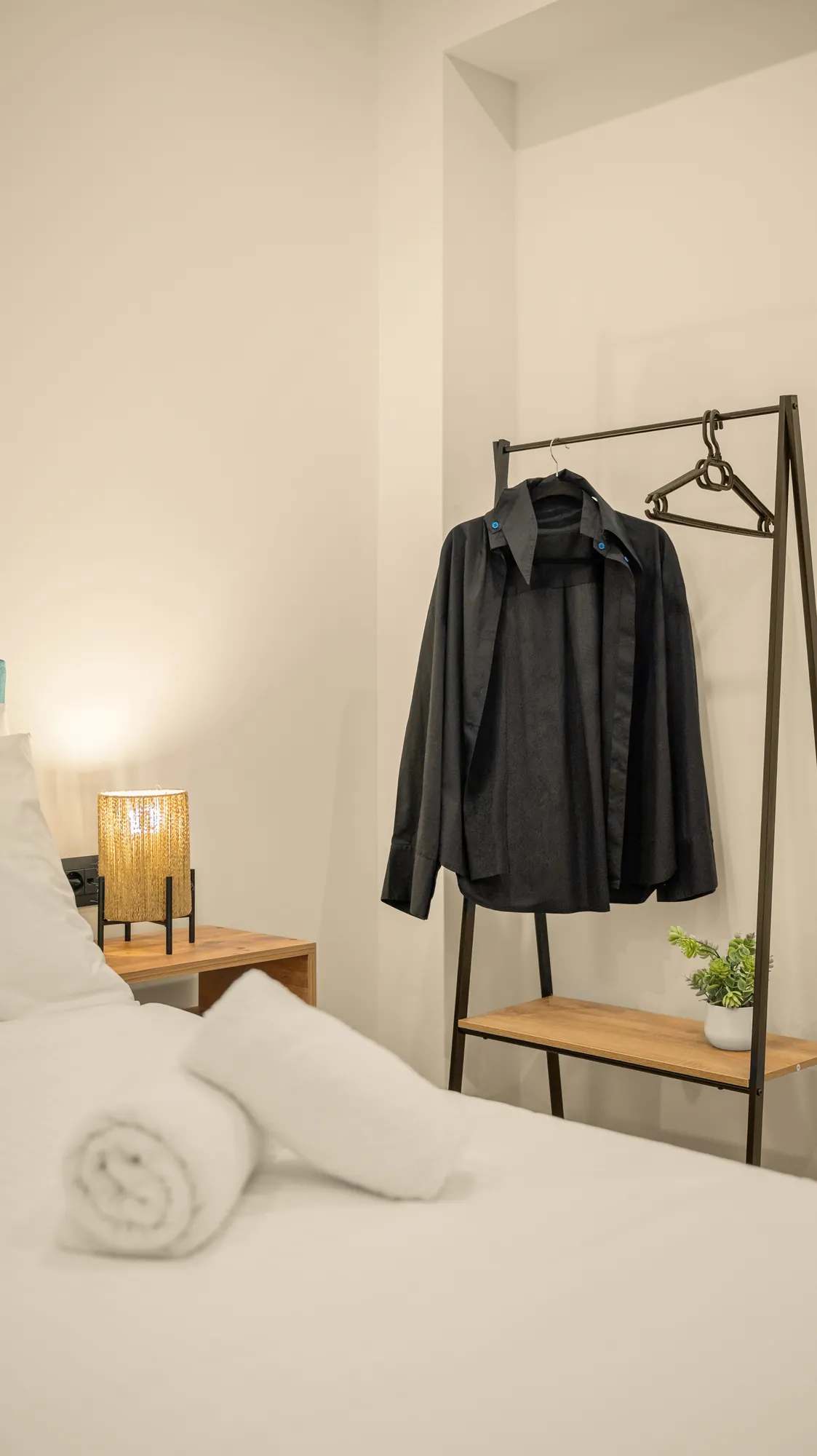 ORMOS Piraeus, the black jacket on the clothes rail by the bed