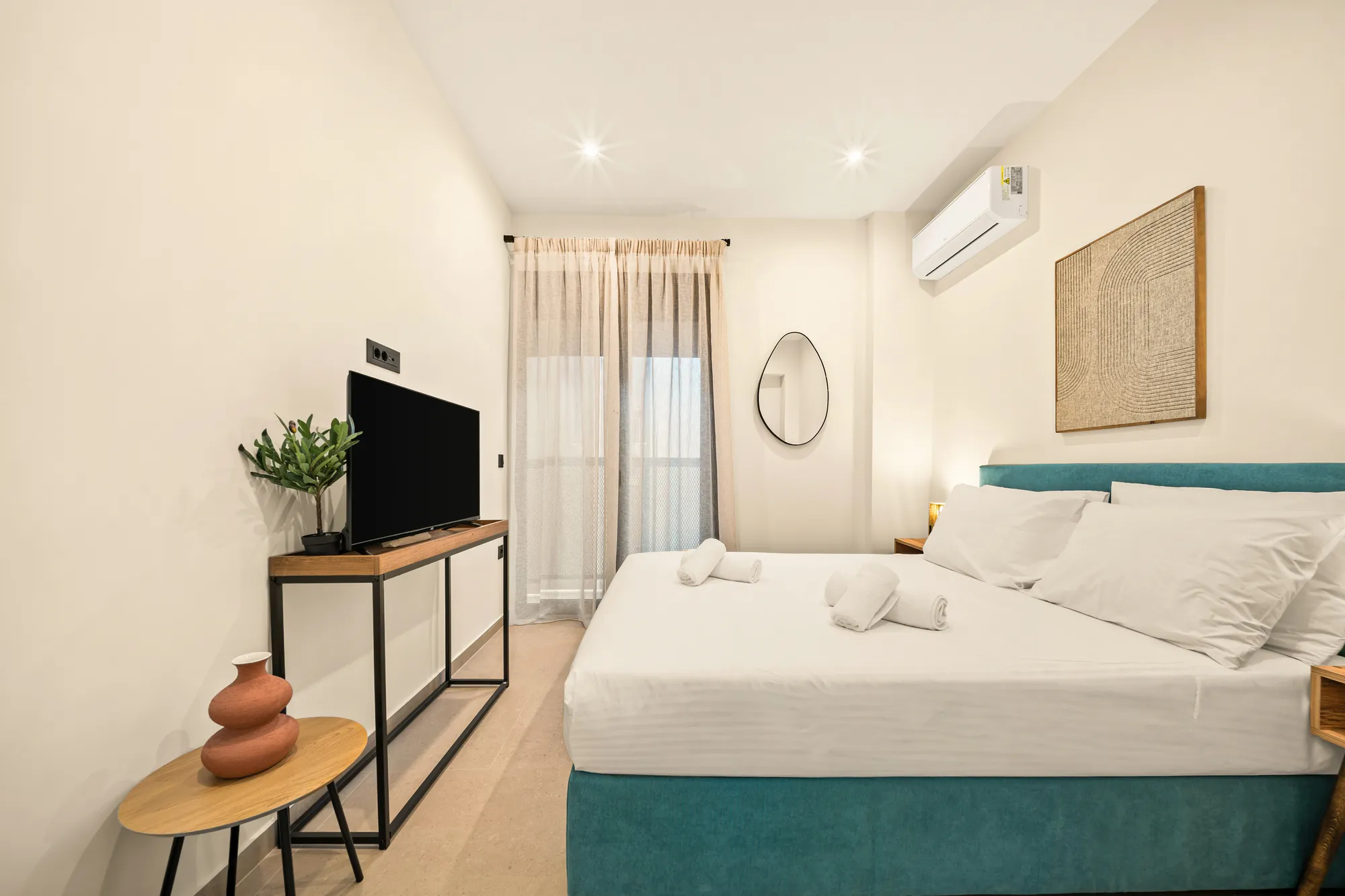 ORMOS Piraeus, the teal bed under the woven artwork