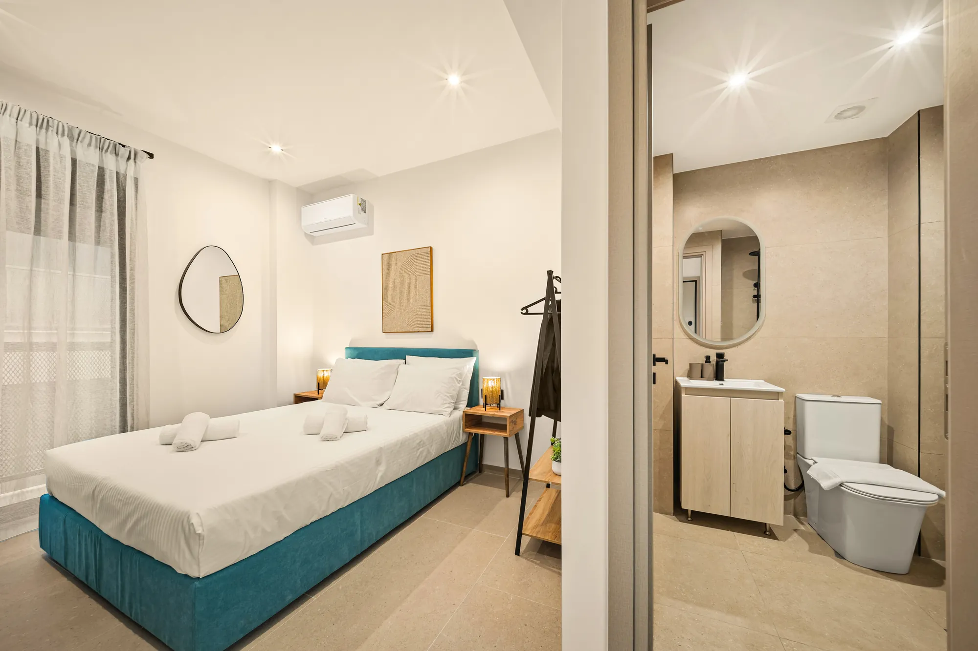 ORMOS Piraeus, the bed and the open door to the bathroom