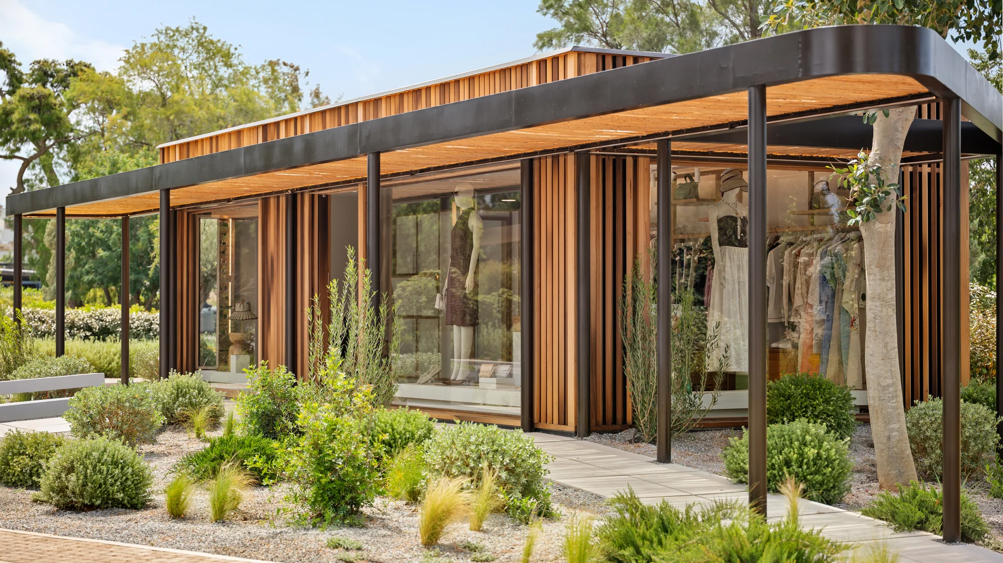 One&Only Aesthesis, a timber and glass retail pavilion in the garden