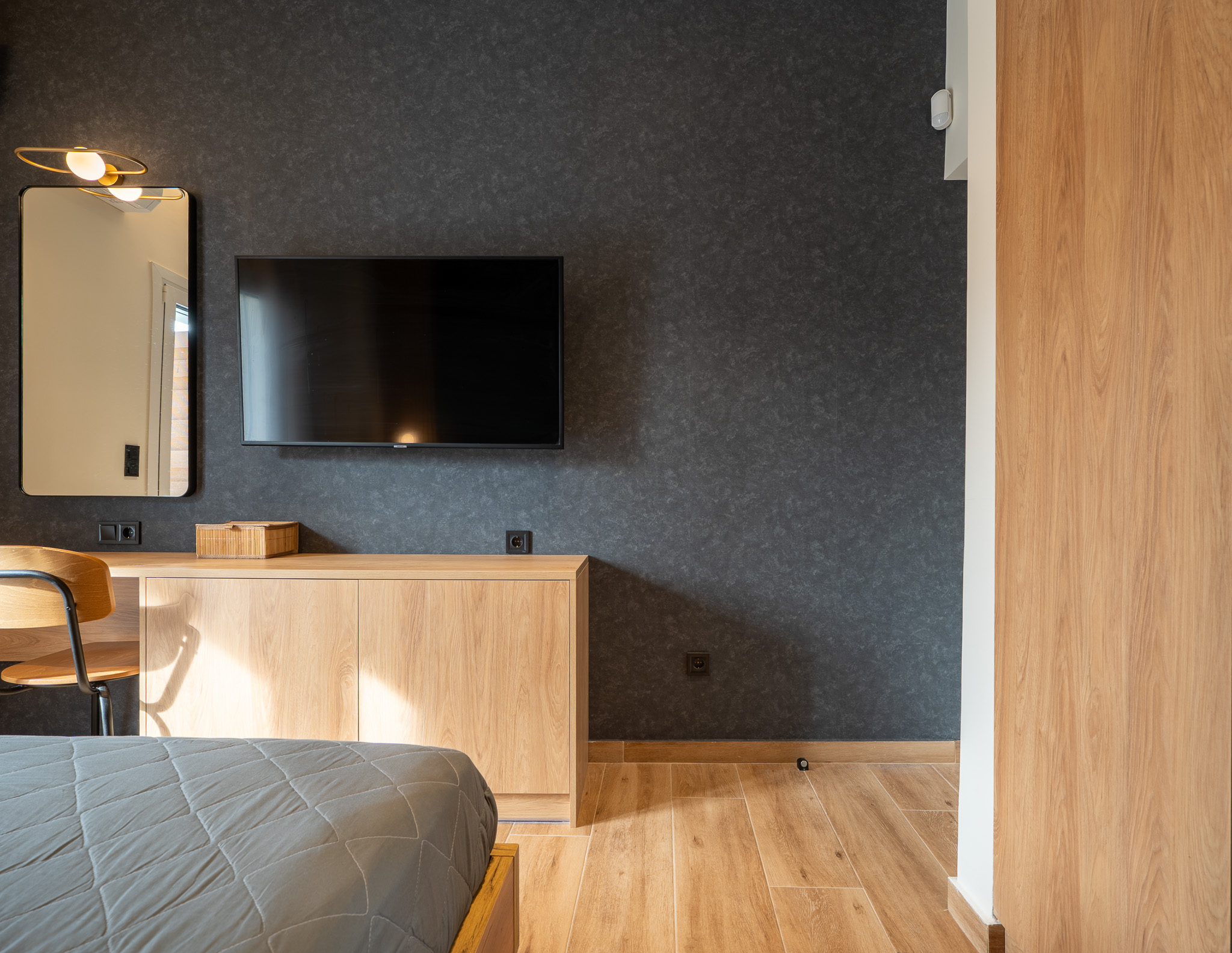 A&K Chorothetisis, bedroom desk nook with charcoal wall and oak credenza