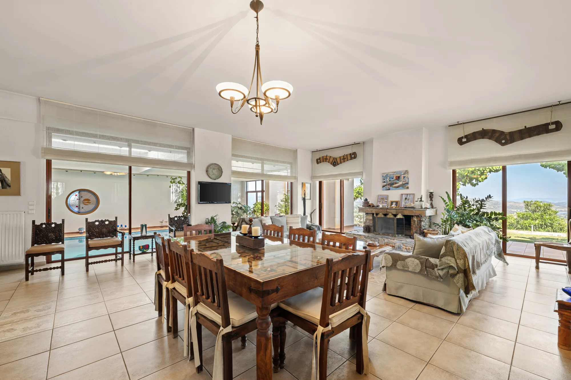 Verde Vista, the great room with dining and sitting areas and panoramic windows
