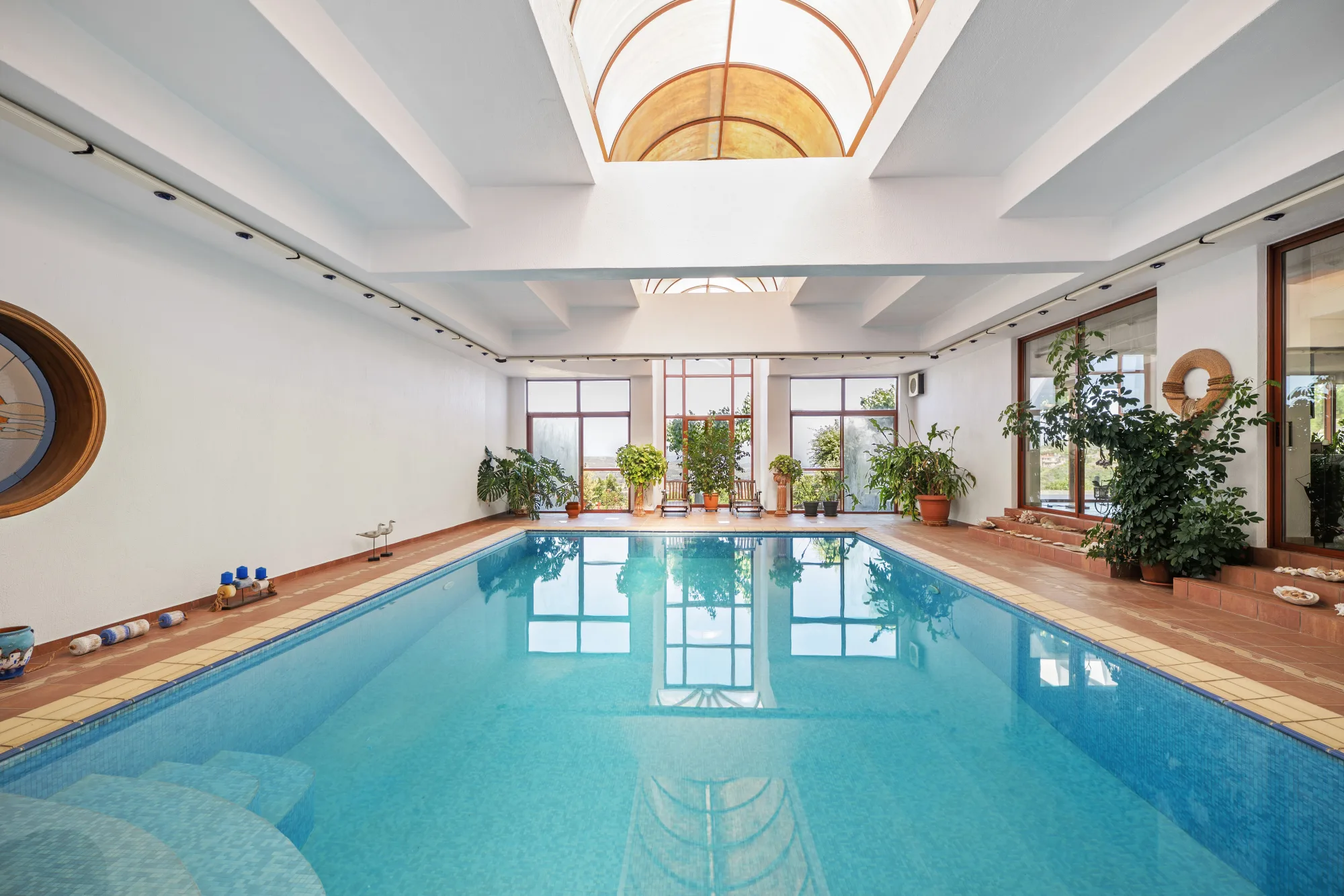 Verde Vista, heated indoor pool under a vaulted skylight with a view