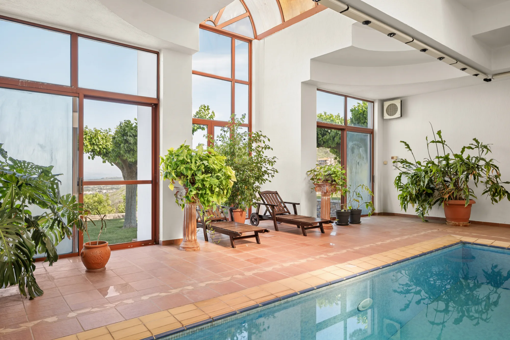 Verde Vista, indoor pool in a glass conservatory with planting