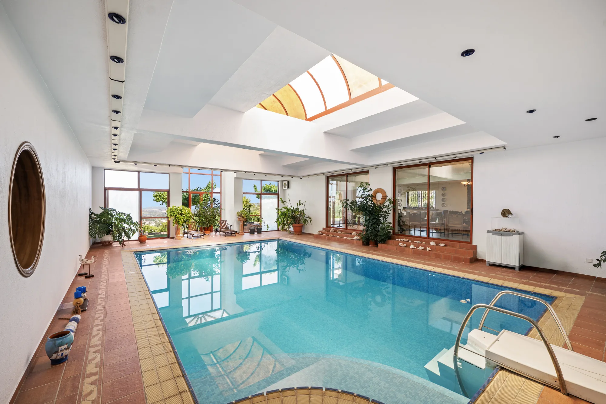 Verde Vista, indoor pool below a round window and skylights