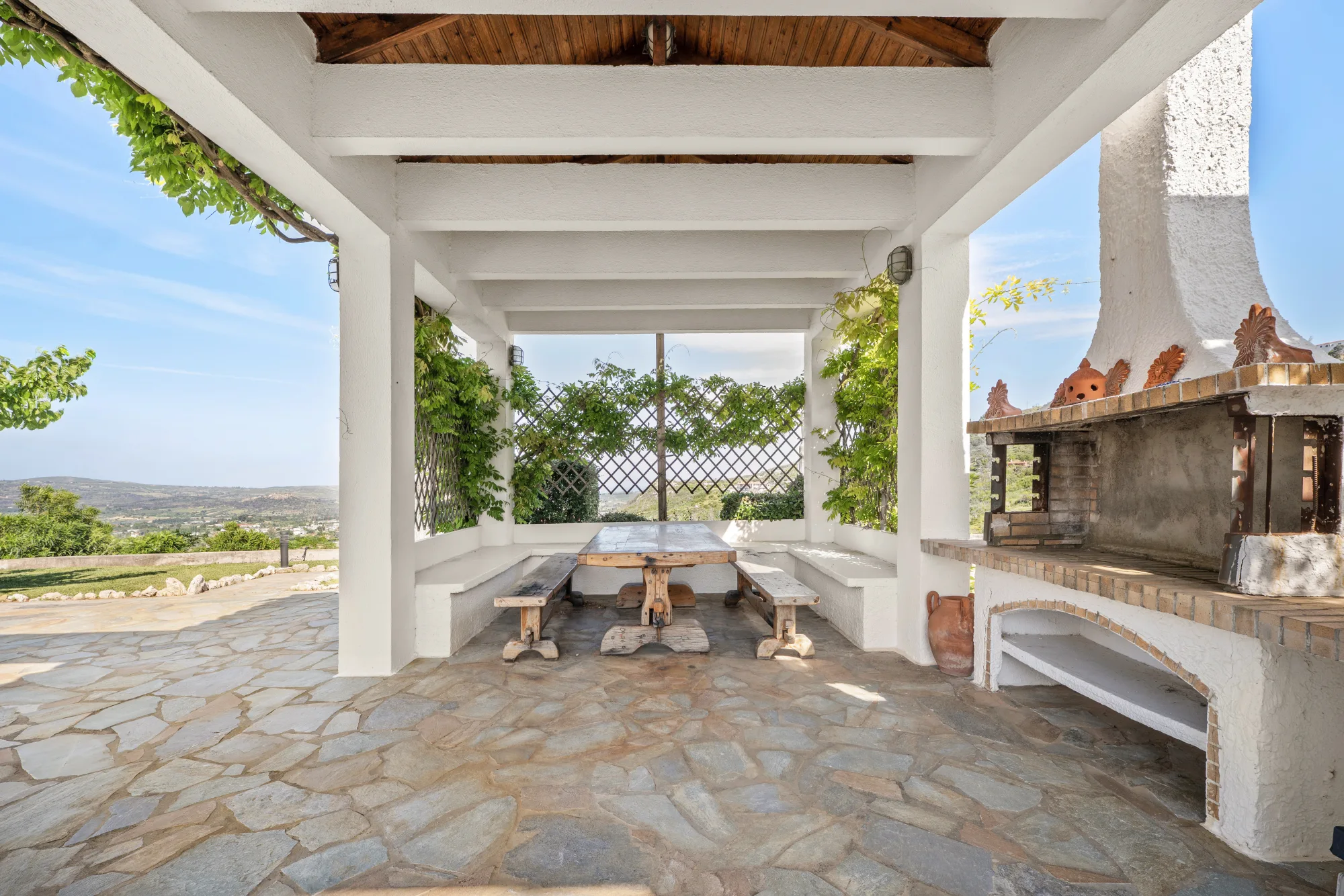 Verde Vista, covered outdoor fireplace and dining area