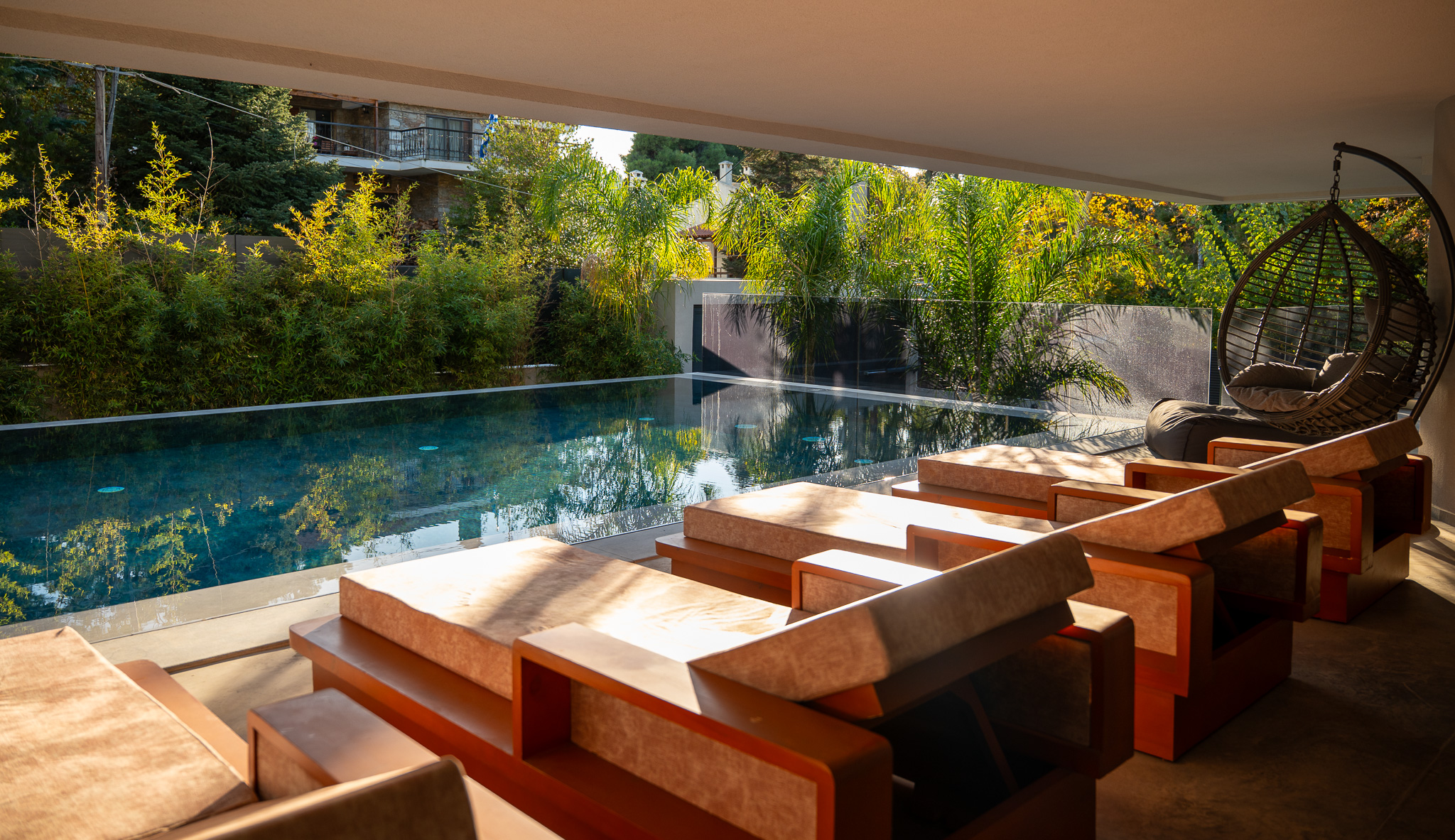 Villa Bond, covered terrace seating area looking onto pool