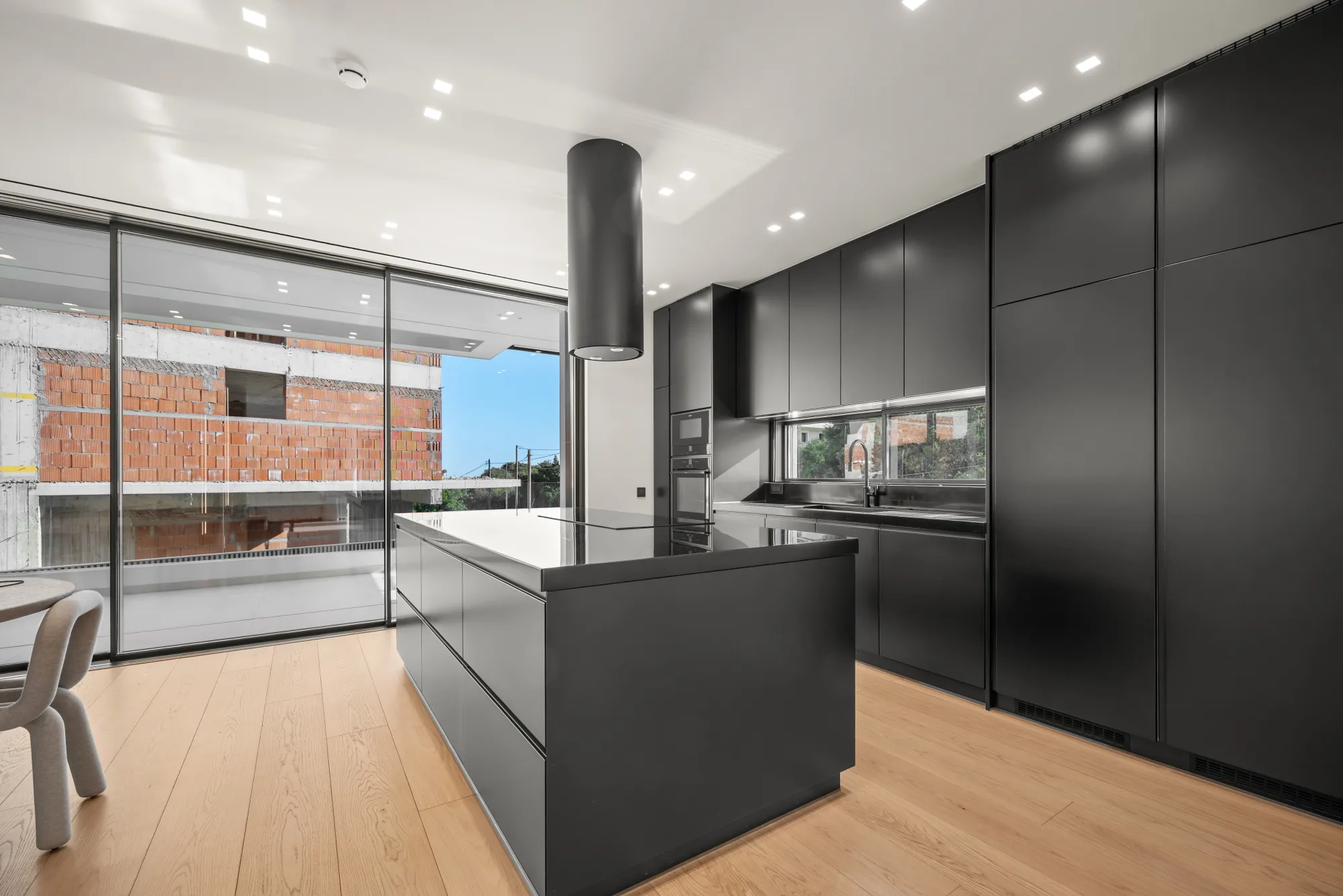 Villa Eden, kitchen with black cabinetry and island