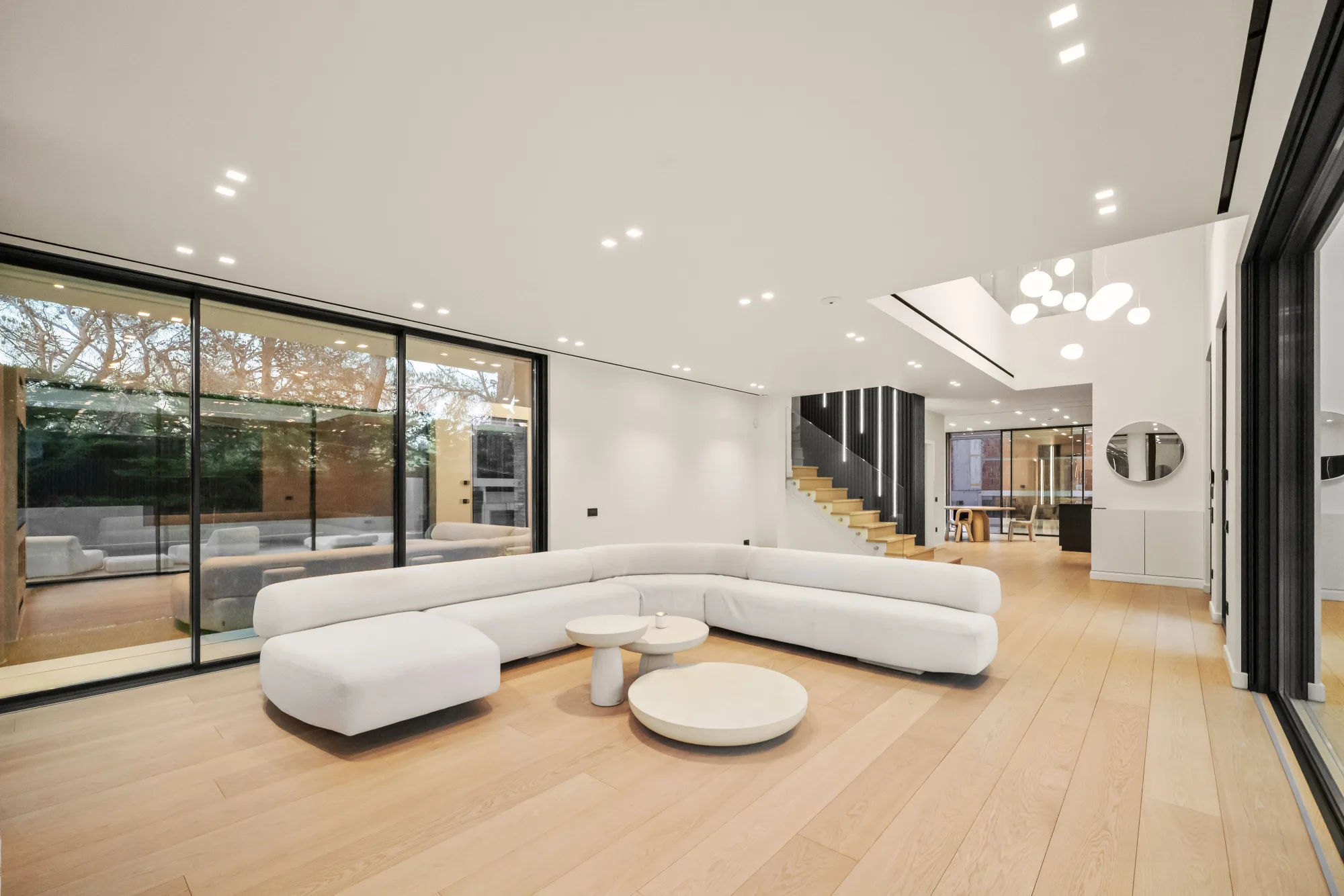 Villa Eden, wide living room with sofa and glass wall