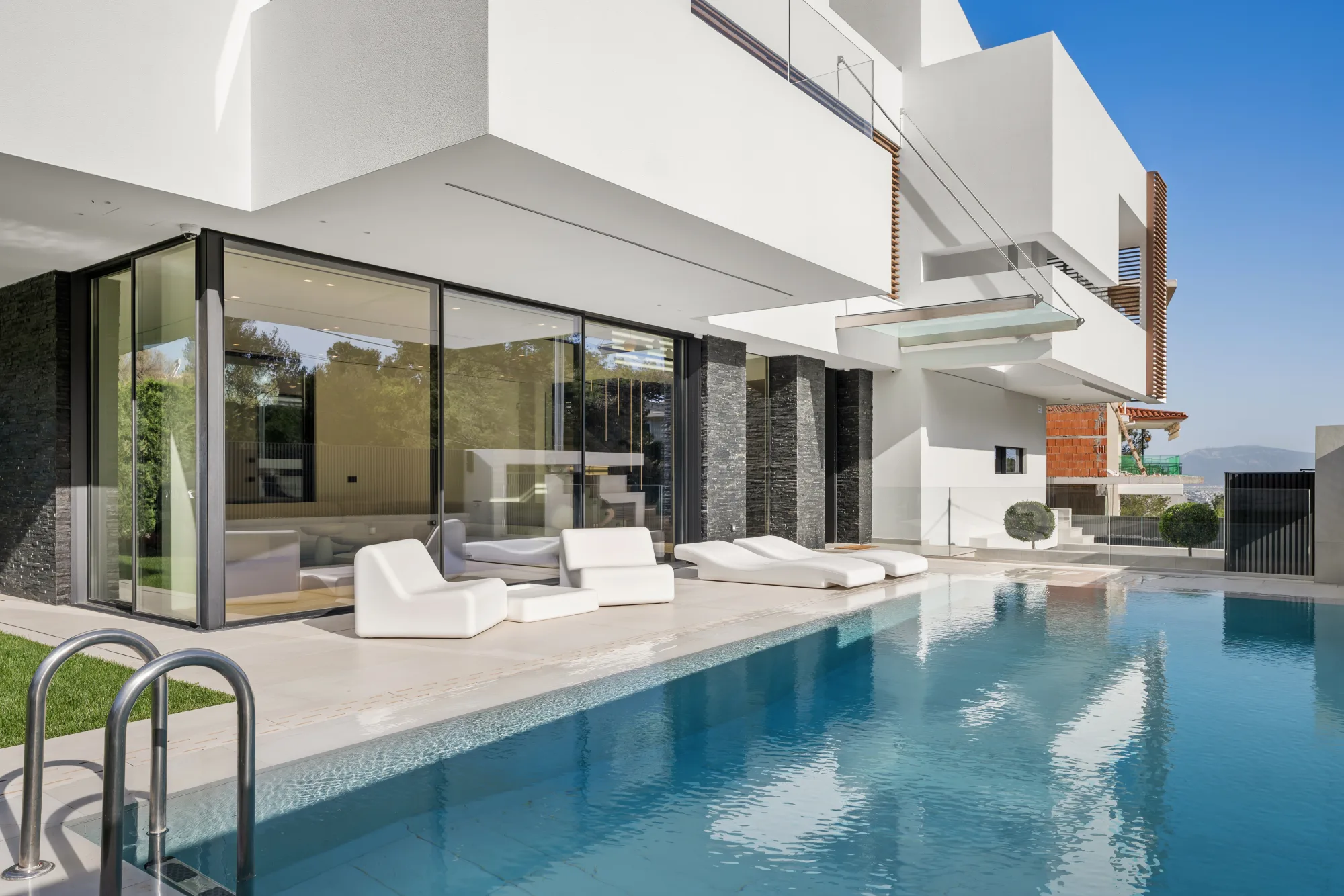 Villa Eden, pool terrace with full-height glazing