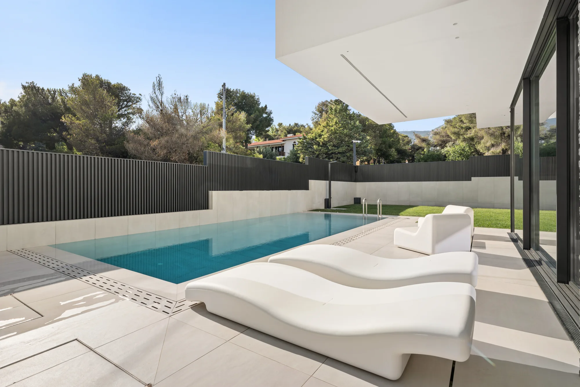 Villa Eden, pool with sun loungers and garden