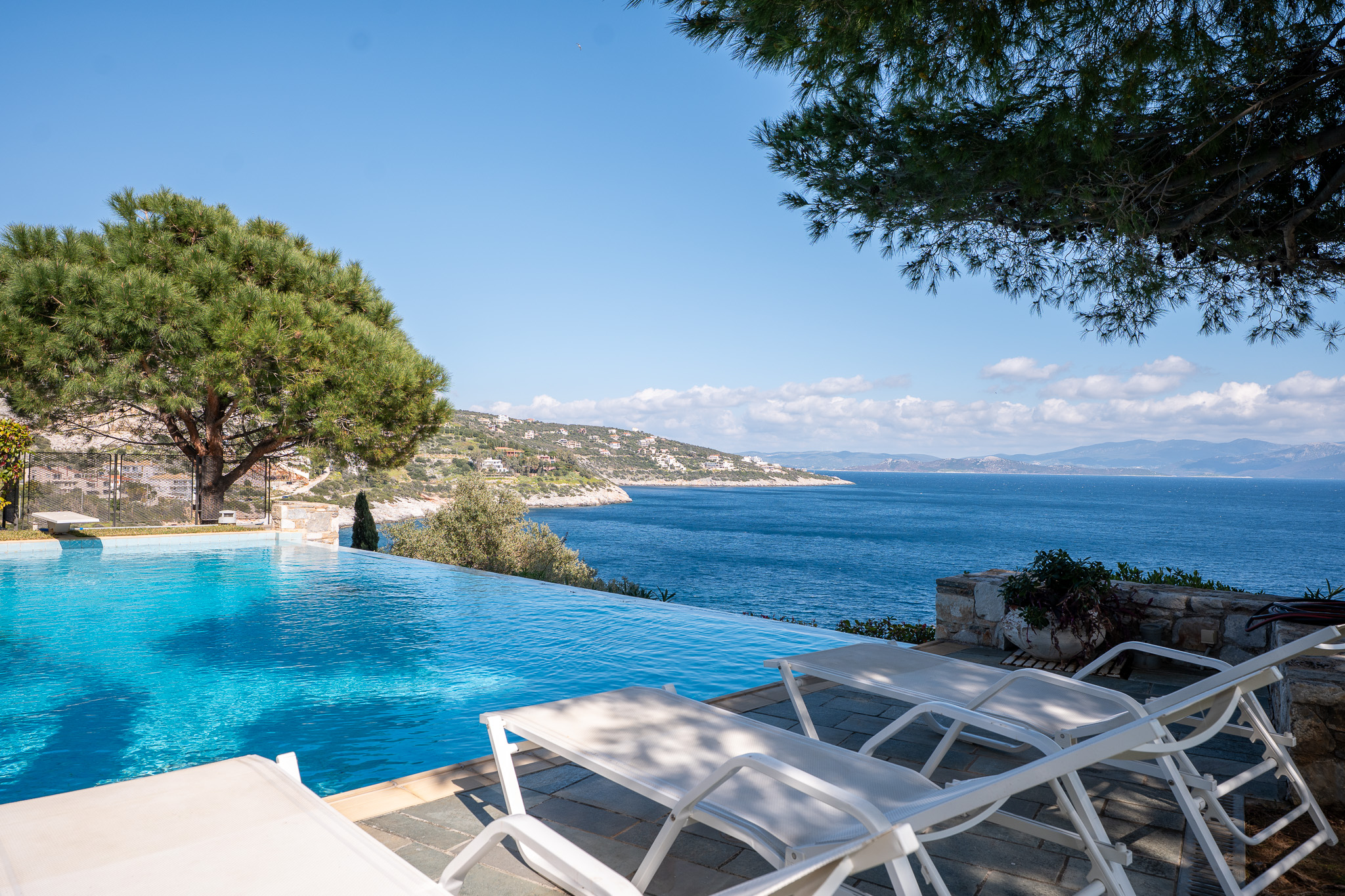 Villa Selene, sun loungers beside the infinity pool