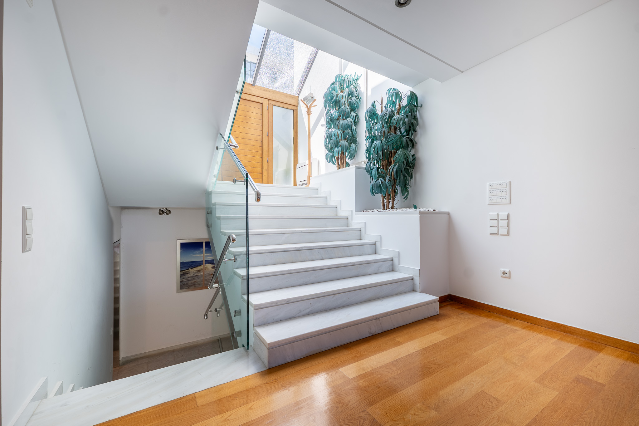 Villa Selene, white marble stair below skylight