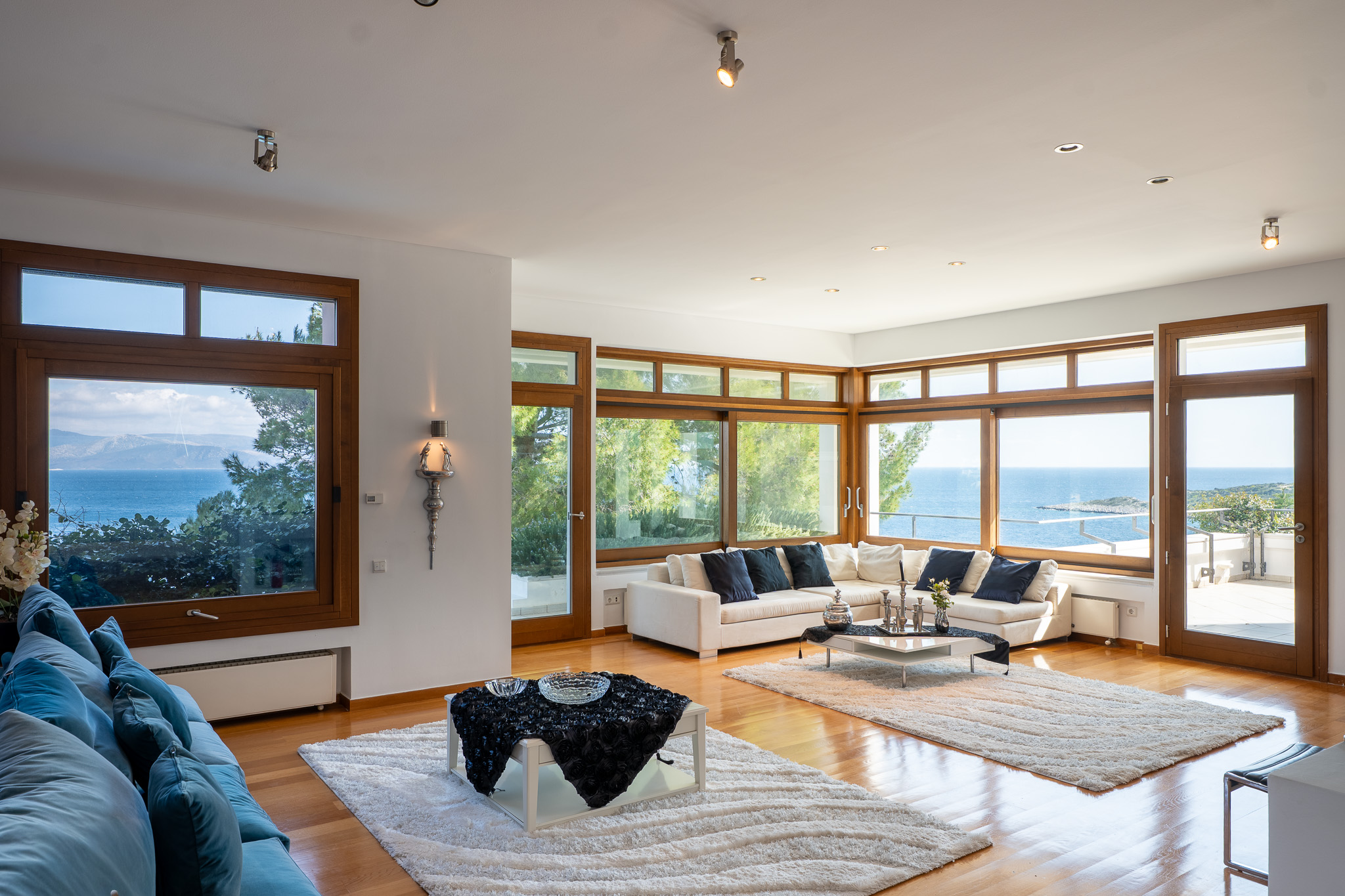 Villa Selene, grand corner living room with wraparound sea windows